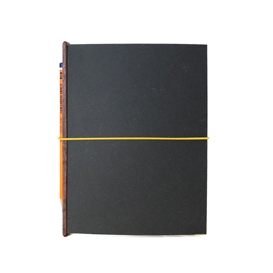 the one with the pencil. a5, black & yellow