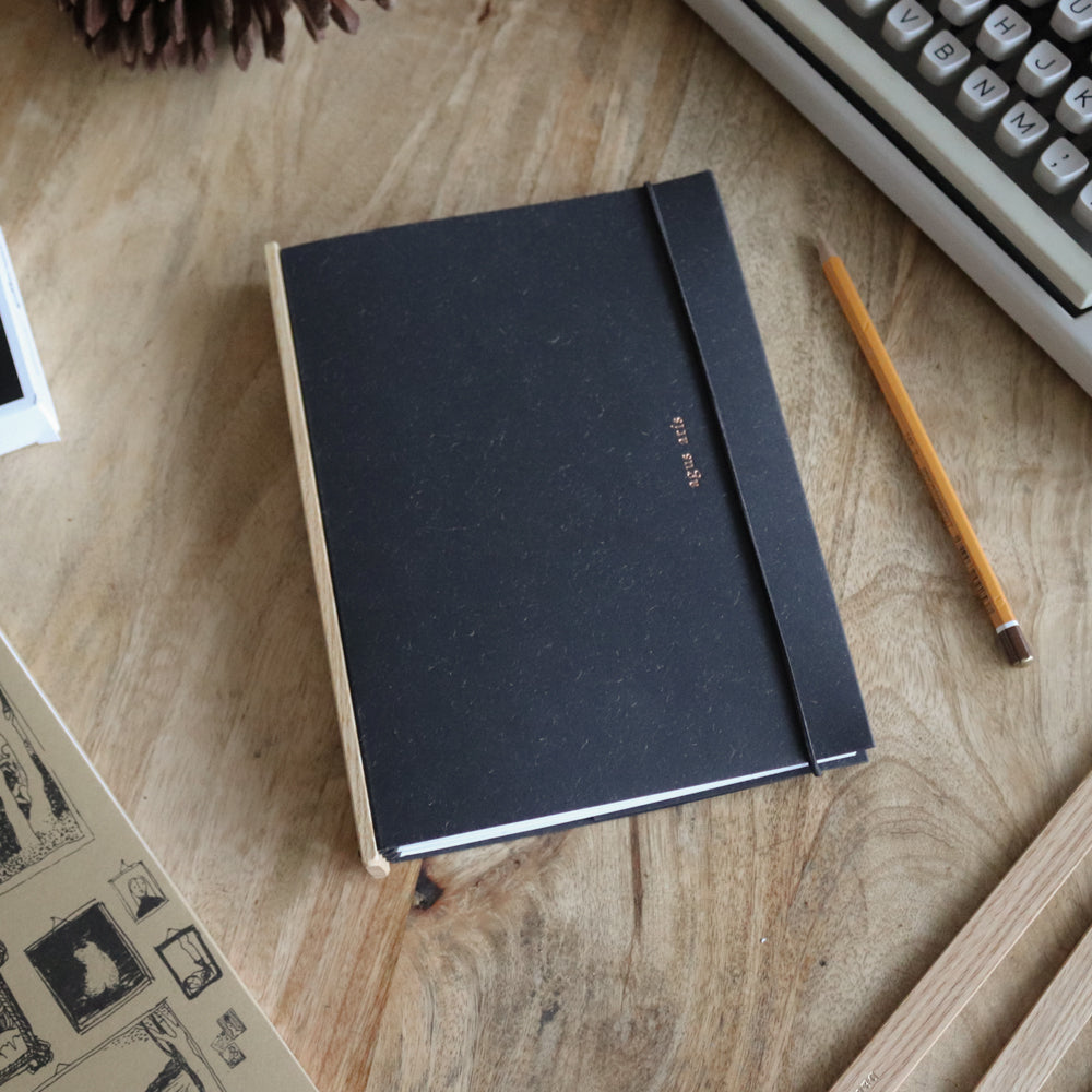 the one with the pencil. a5, black