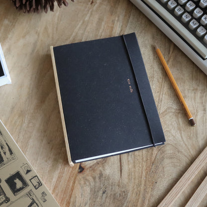 the one with the pencil. a5, black